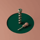 A AI-generated app icon of a hole driller in sandy brown , dark olive green , rose gold , beige color scheme