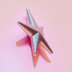 A AI-generated app icon of a shooting star in snow , light pink , rose color scheme