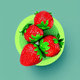 A AI-generated app icon of a strawberry in rose red , dark sea green color scheme
