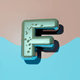 An app icon of  an image of a letter F with champagne and tiffany blue and blue green and army green scheme color