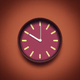 An app icon of a clock with saddle brown and deep pink color scheme